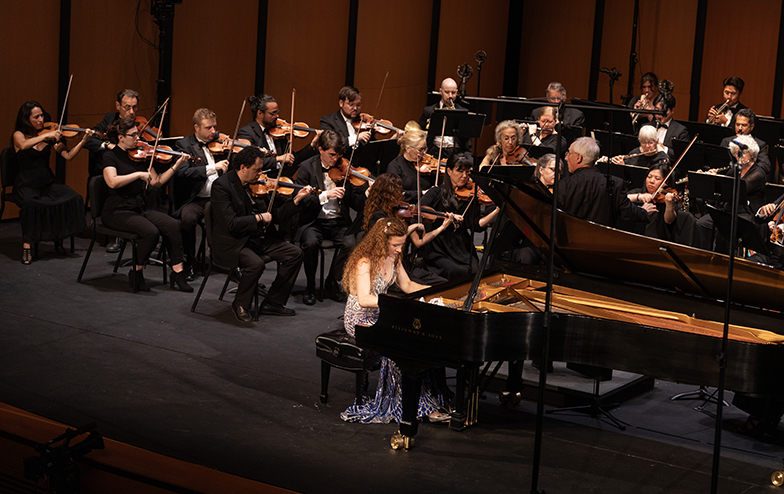 A photo of Asiya Korepanova playing piano during the MostArts Festival