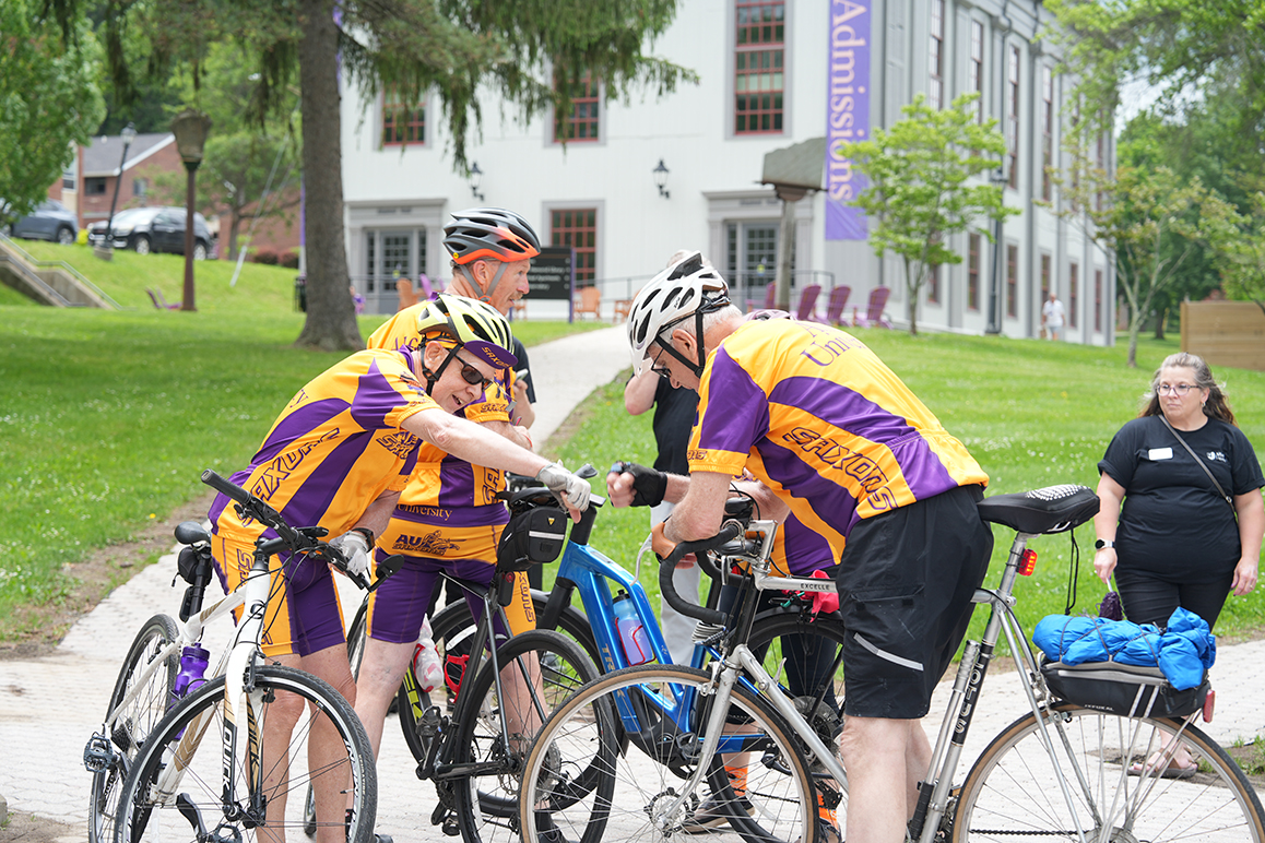 A photo of Alfred University alumni riding bicycles