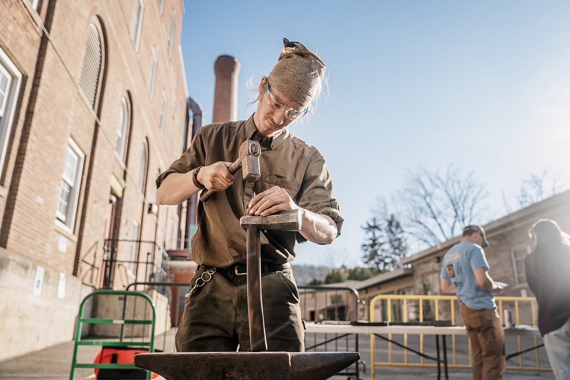A photo of a student using an engineering tool
