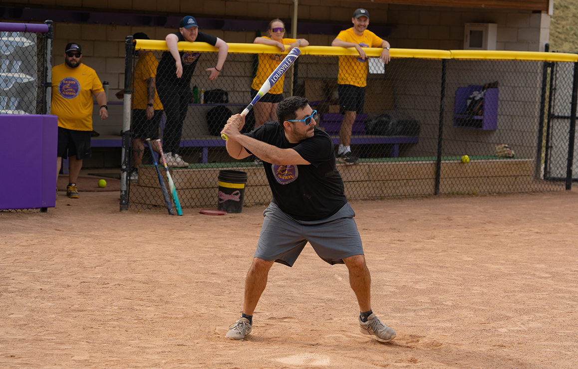 A photo of Alfred University faculty and staff playing softball