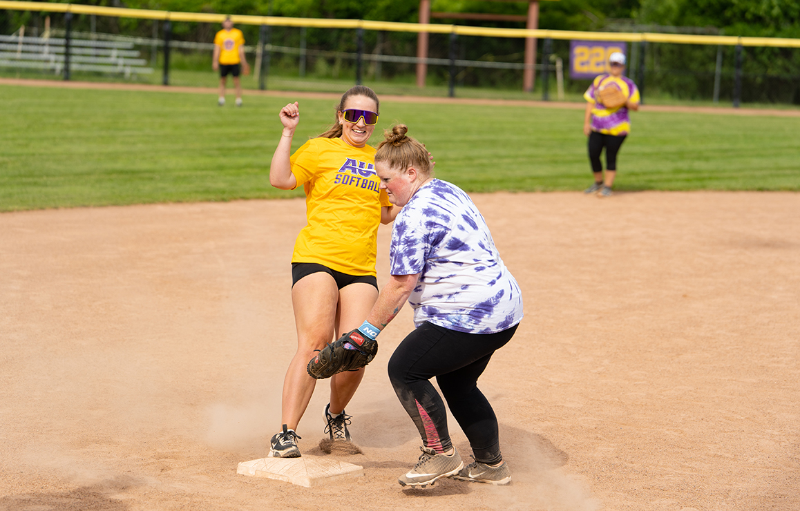A photo of Alfred University faculty and staff playing softball