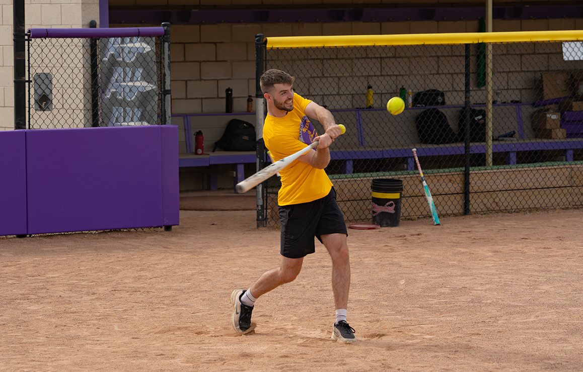 A photo of Alfred University faculty and staff playing softball