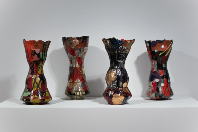 four colorful vases