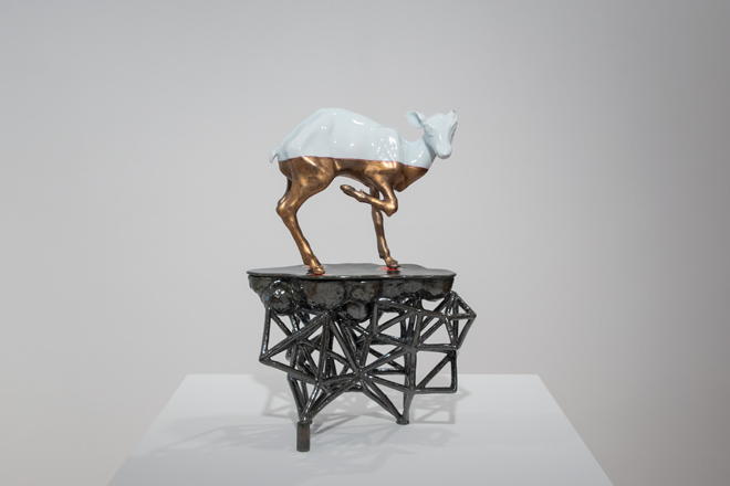 ceramic piece featuring a cautious deer