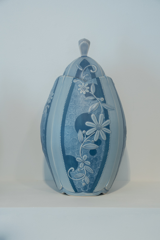 closeup of another blue vase with flowers