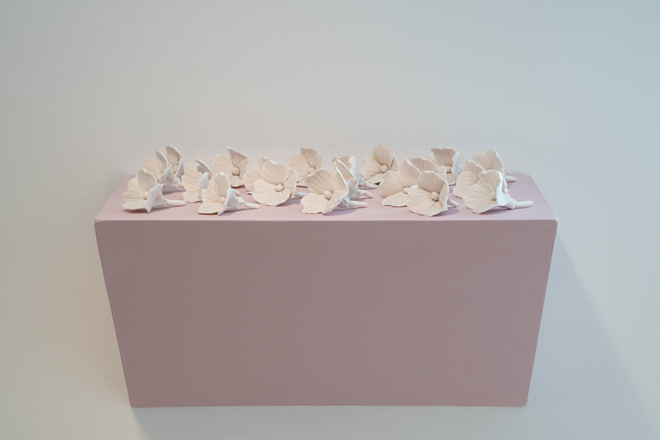 pink box with ceramic flowers on top