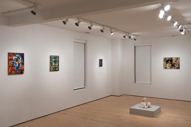 different corner of gallery space filled with sculptures and paintings