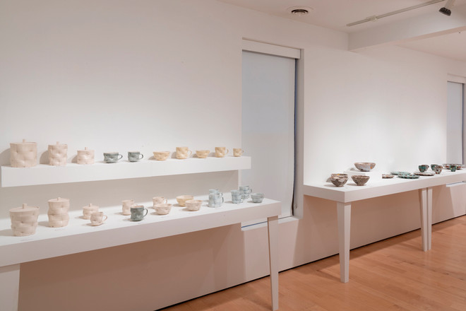 empty gallery space with pottery all displayed