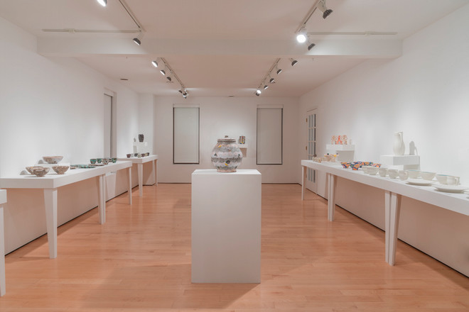 empty gallery space with pottery displayed