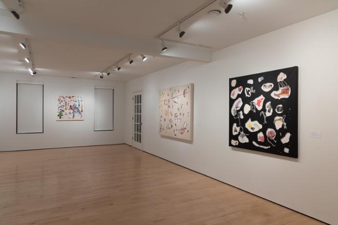 different corner showcasing various paintings hung on the wall