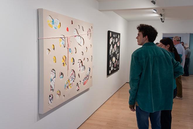 person viewing artwork on display