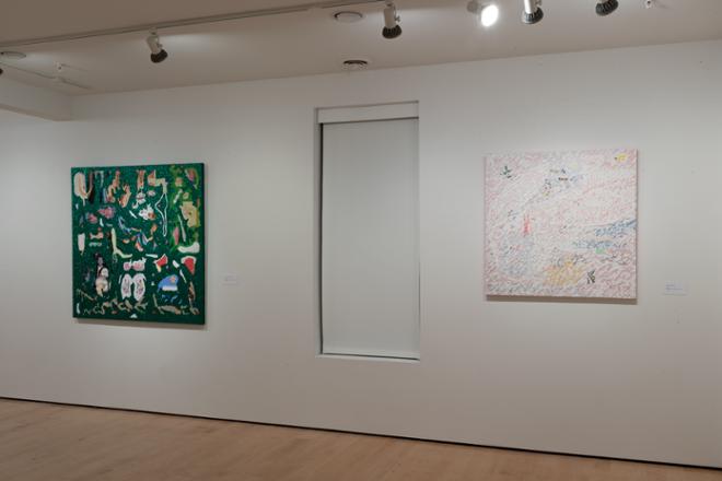 wall of two paintings hanging on the wall