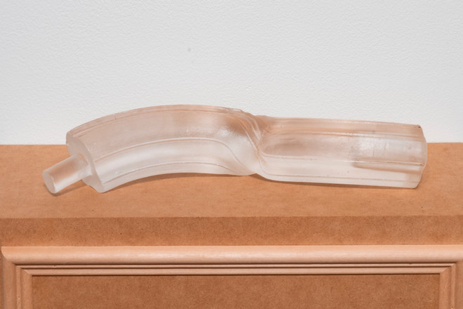 detail look at glass piece on a wood block