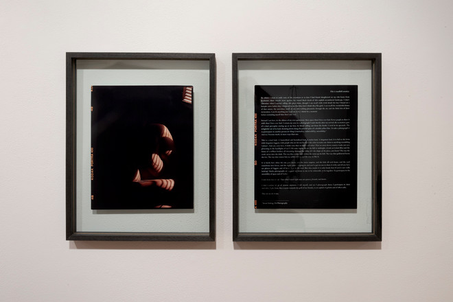 two dark prints hung on the wall