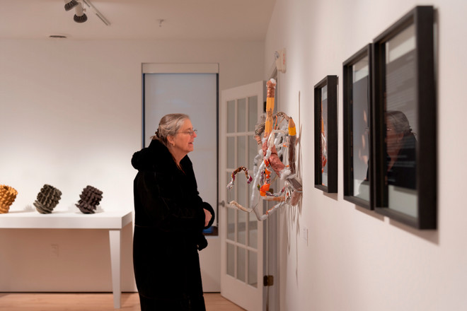 people viewing the artwork on display