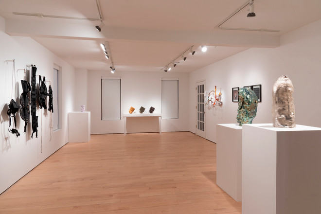 empty gallery space with artwork on display