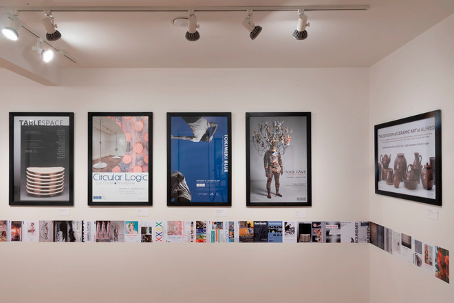 A section of the Poster Archives 2001–2024 exhibit featuring five framed posters: “Table Space,” “Circular Logic,” “TOKYOTO—Nick Kuder,” “Nick Cave,” and “The Division of Ceramic Art at Alfred.” A continuous row of small exhibition flyers and promotional materials runs beneath the posters along the wall.