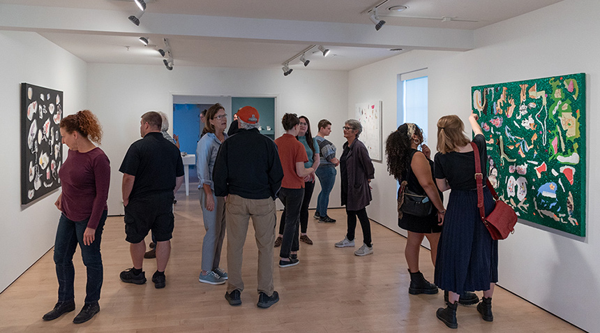 crowd of people viewing an exhibit