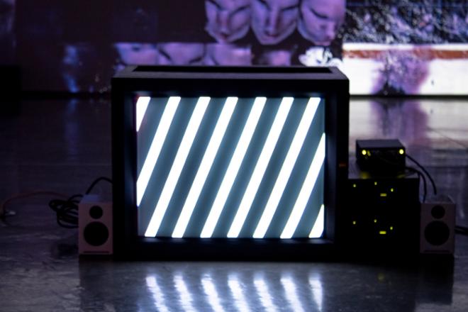 close up of monitor with slanted white stripes on screen