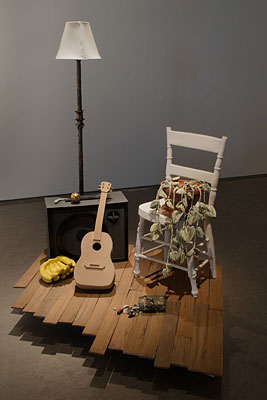 chair, lamp, guitar and an amp
