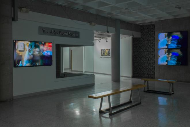 A Bench and TV Screen in the Gallery