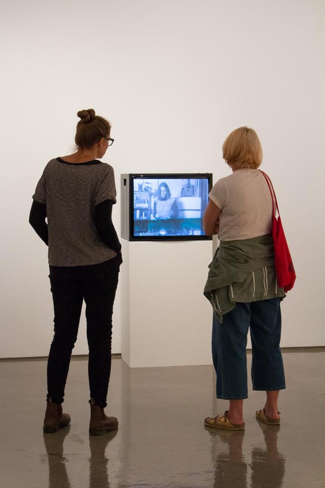 people viewing a piece