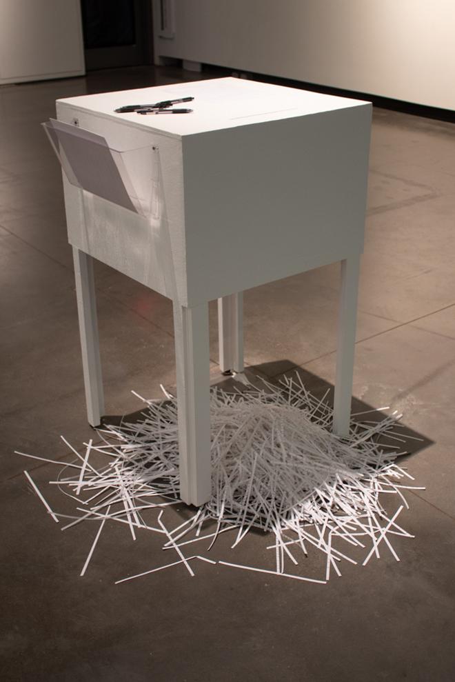 table with pens and chair