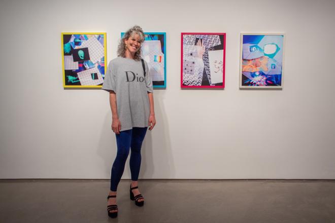 Artist Lydia McCarthy posing in front of her work