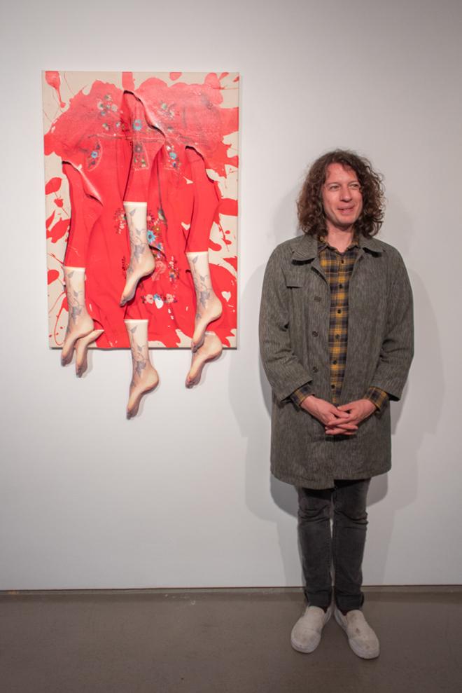 Artist David Kennedy Cutler beside one of his pieces 