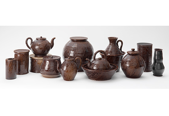 collection of brown glazed ceramic pottery, vases, jars, teapots