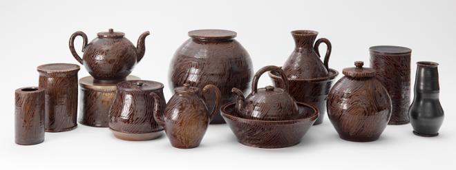 collection of brown ceramic pottery, vases, jars, teapots