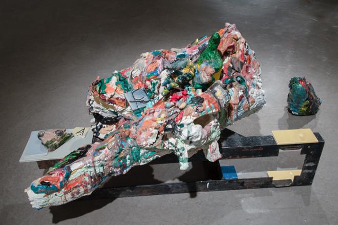 sculpture piece on the floor featuring various colors melted together