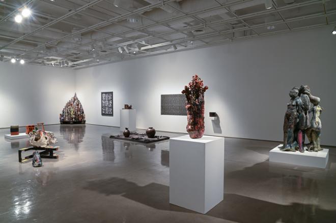 gallery room with multiple ceramic sculptures layed out