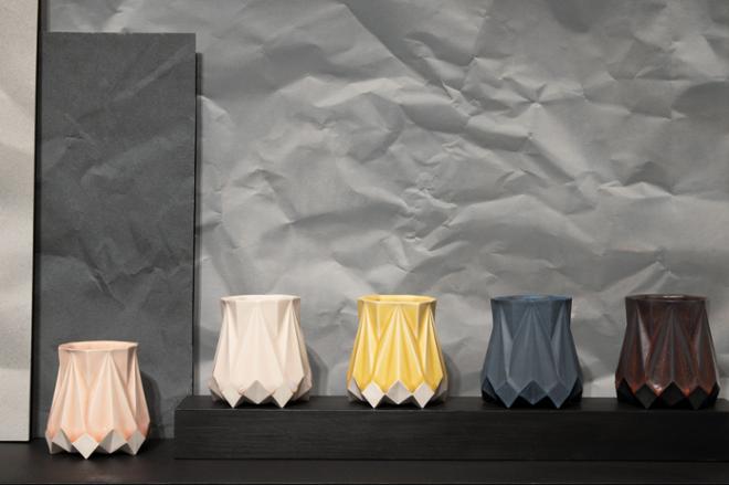 closer look at geometric ceramic vases in various colors