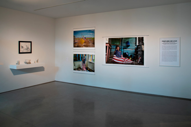 display of various art pieces by Juan Barroso and Joann Quinones