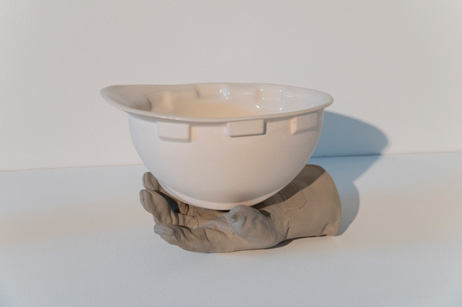 art piece by Juan Barroso of a glove holding an object