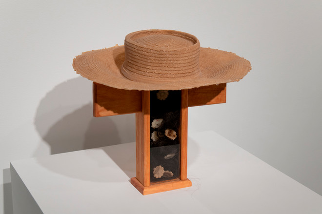 art piece using various materials sitting on a platform by Jada Patterson