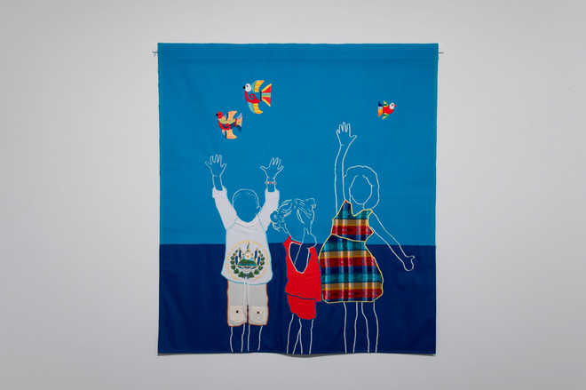 art piece of children playing using materials of repurposed family clothes by Arleene Correa Valencia