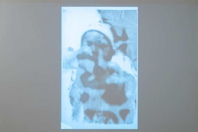 projection of a stylistic and monochrome image of a newborn by Lucy Kim