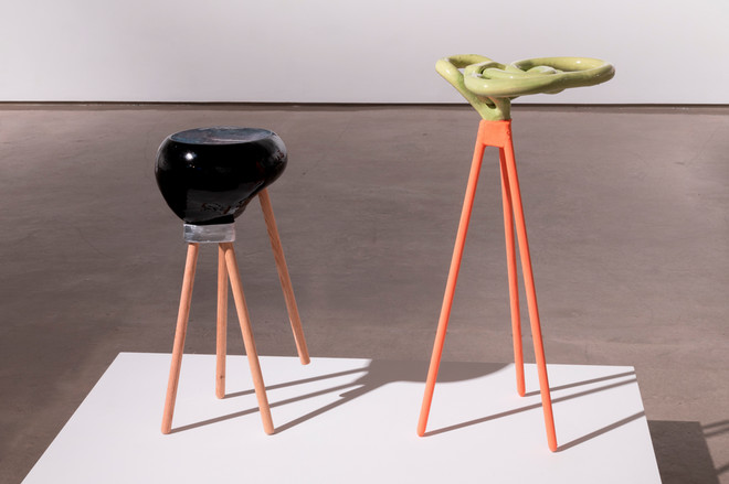 a pair of sculptures displayed