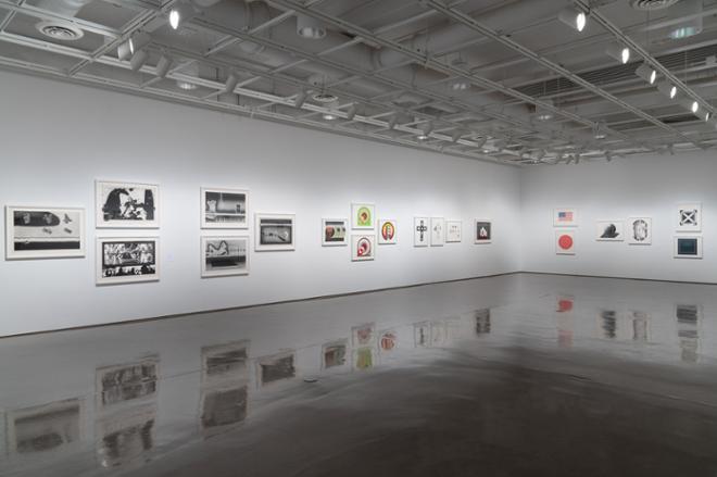 gallery space with lots of various artwork on the walls