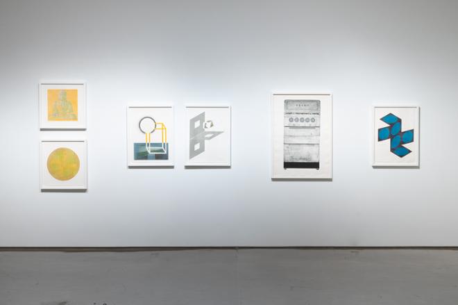 another wall of various prints organized by color