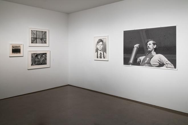 corner of the gallery with various prints