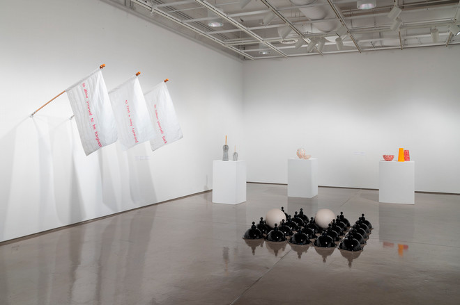 one corner of the exhibit with various installations on the wall and on the floor