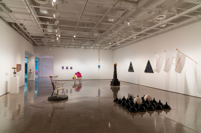 different angle of the gallery space filled with various sculptures