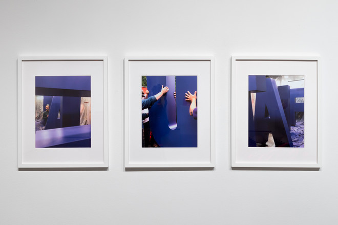 series of three prints displayed on the wall