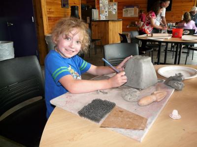Young male student at clay workshop