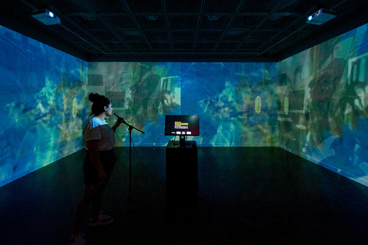 karaoke setup in the 3d interactive studio with moving visuals on all surrounding walls