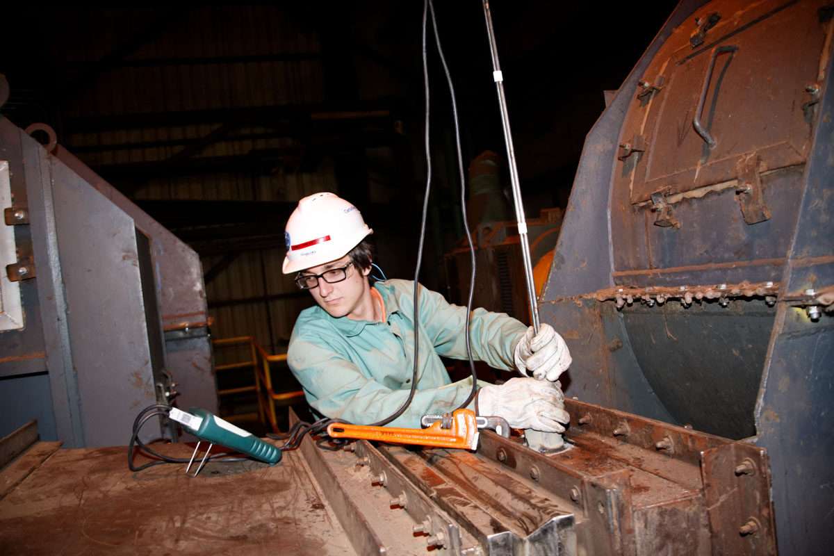 Internship student using a multimeter