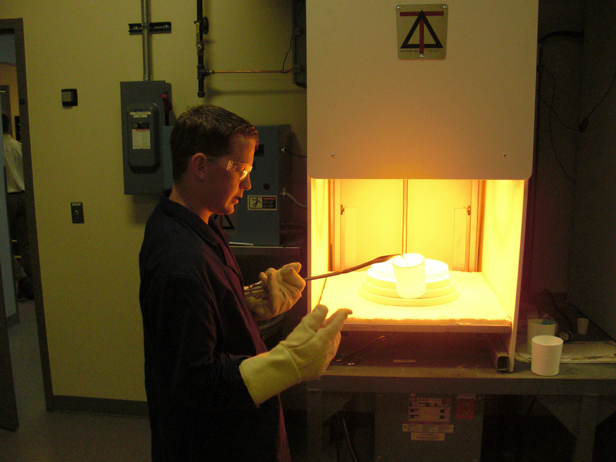Student working with ceramics at an internship site